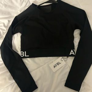Aybl Black long sleeve crop top . Never worn. size small
